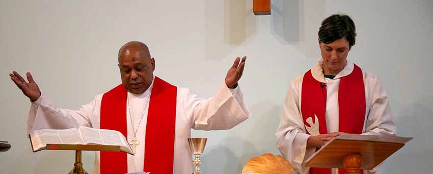 two ministers presiding over the sacraments